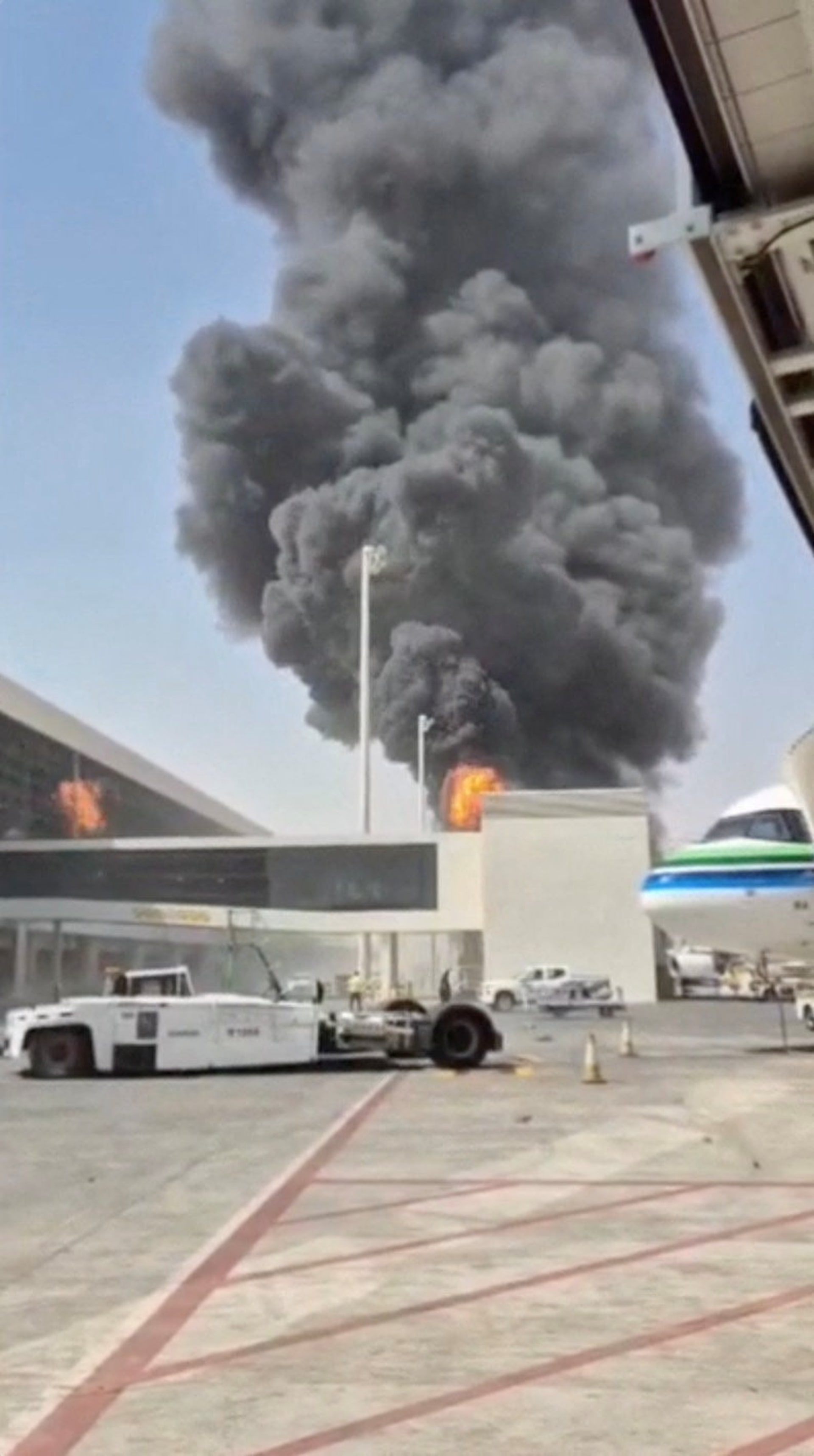 Smoke and flames rise from King Khalid Airport, after Yemen’s Iran-backed Houthis said they attacked the airport, in Riyadh